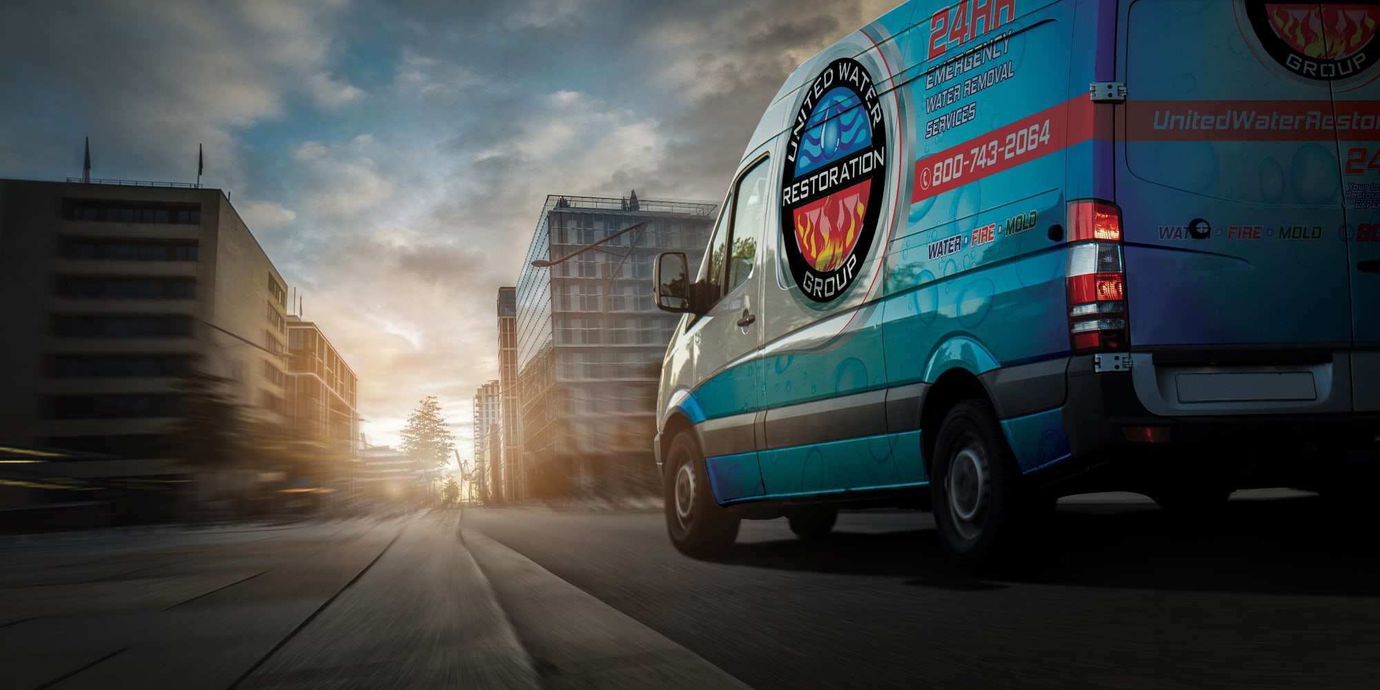 A United Water Restoration Group of Vancouver van heading out on an emergency call at sunset
